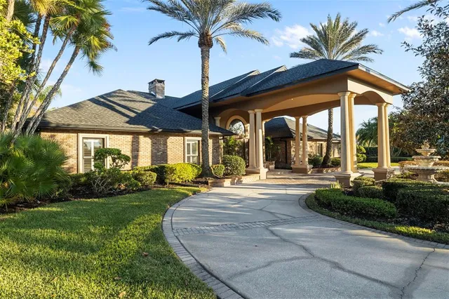 a front view of a house with swimming pool having outdoor seating