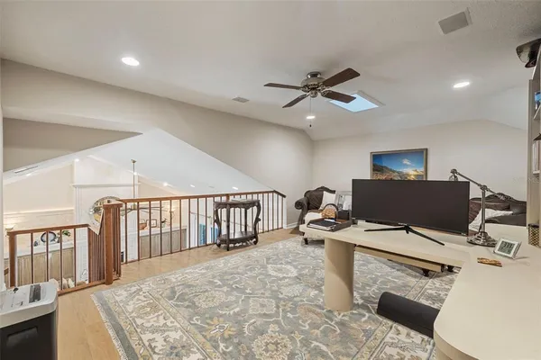 a view of living room with wooden floor and windows
