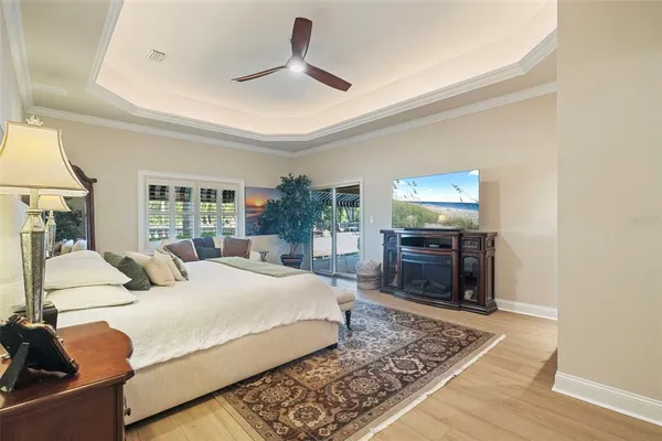 a living room with furniture a fireplace and a large window