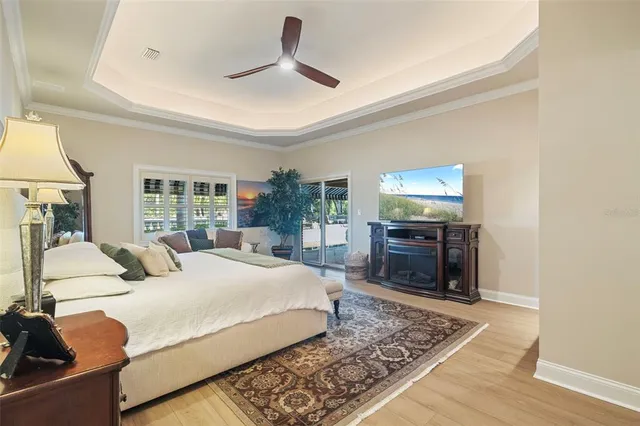a living room with furniture a fireplace and a large window