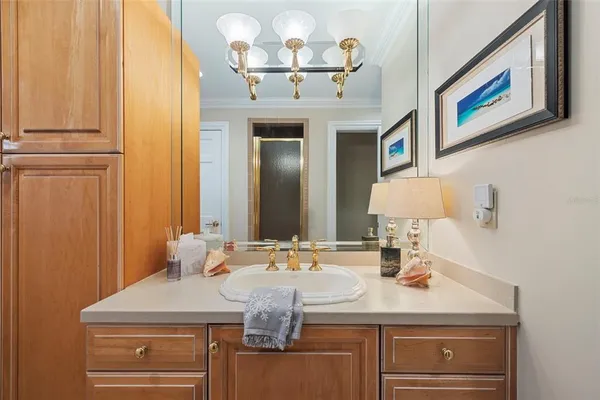 a large living room with stainless steel appliances kitchen island granite countertop a sink and a large mirror