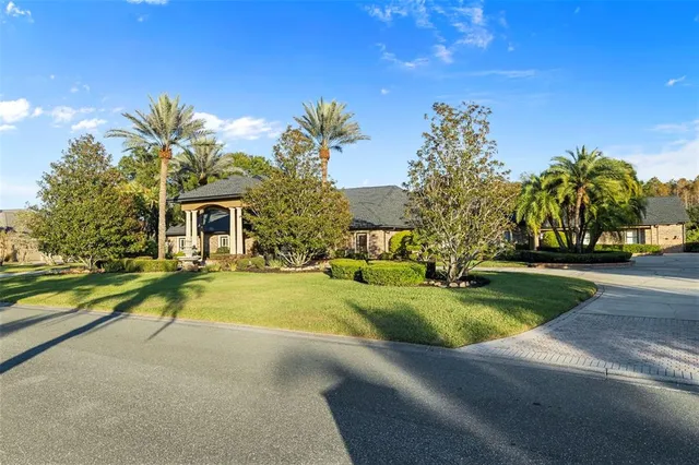 a living room with furniture and large windows