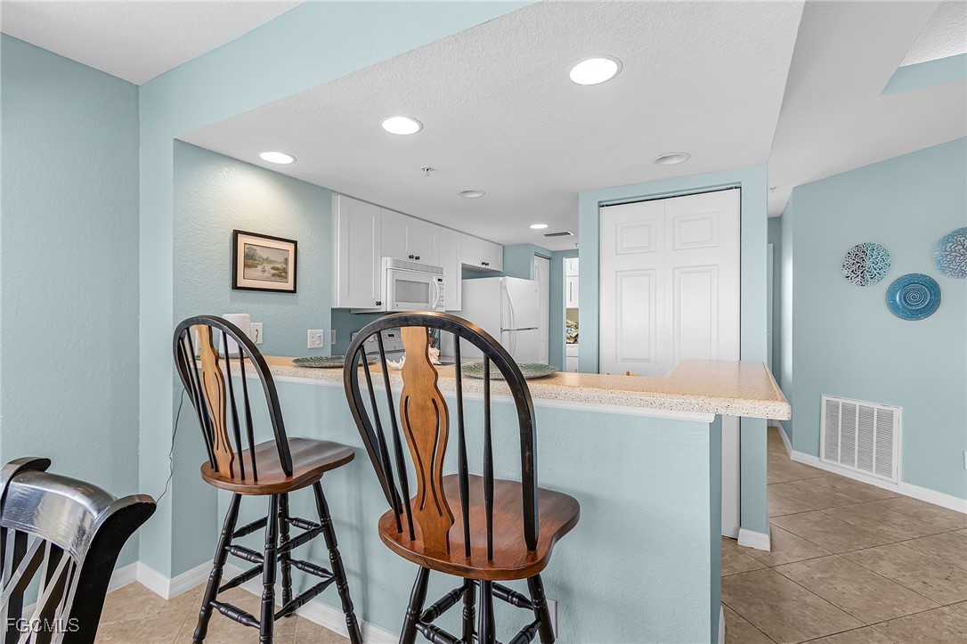 16641 Stringfellow Road, Unit 506 Bokeelia, FL 33922 - Photo 9 of 43 a view of a hallway with furniture