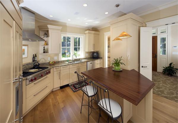 388 Lowell Road Concord, MA 01742 - Photo 3 of 11 a kitchen with a table chairs sink and cabinets