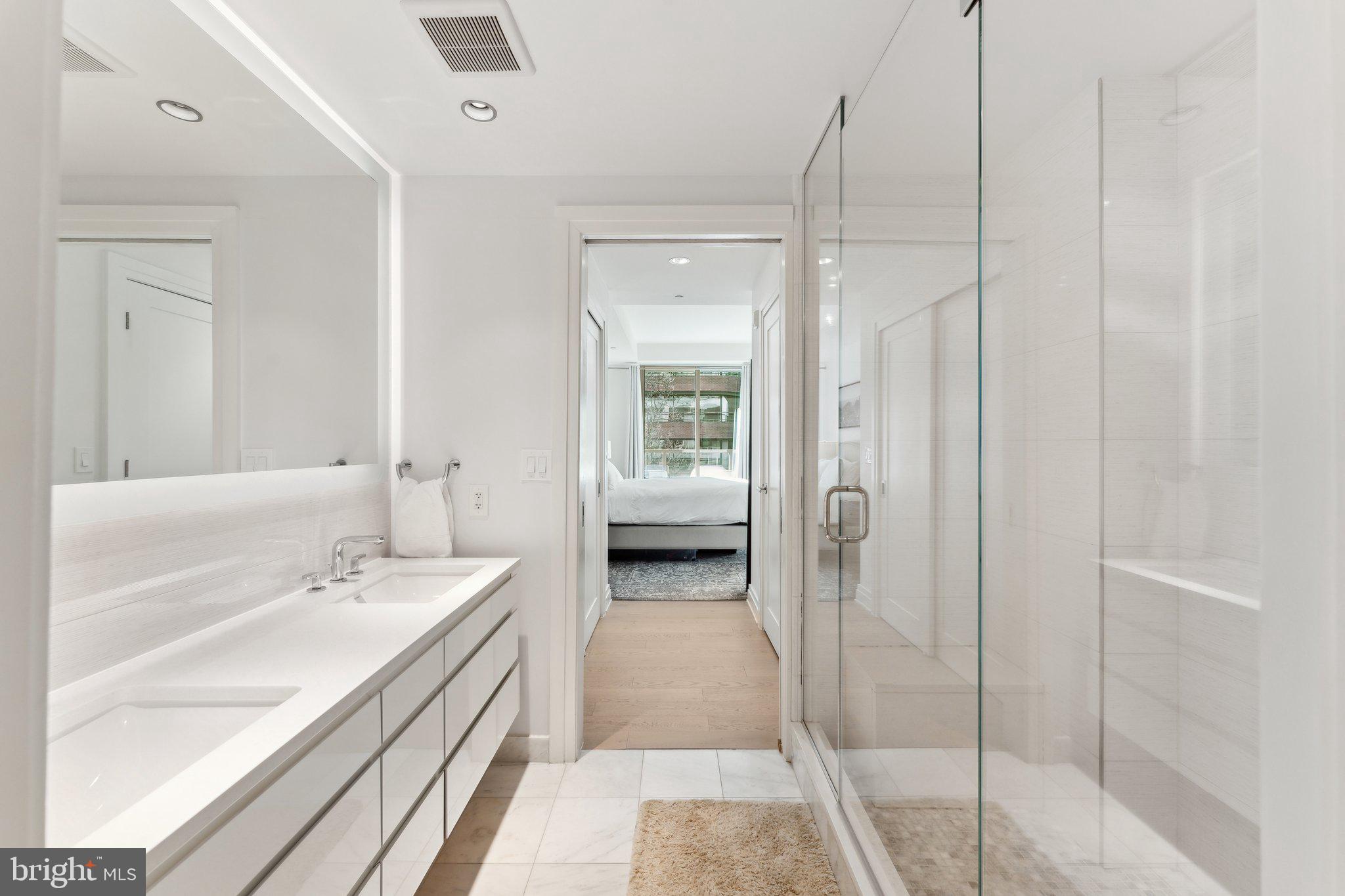 2501 M Street Northwest, Unit 207 Washington, DC 20037 - Photo 14 of 30 a en suite bathroom with a shower and a sink