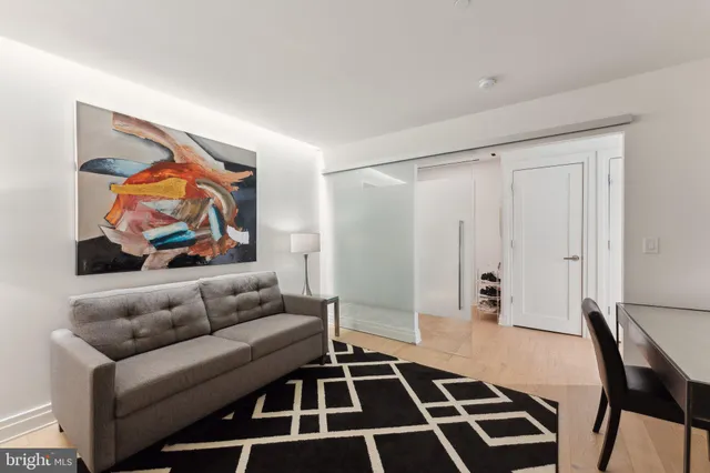 a living room with furniture and a rug