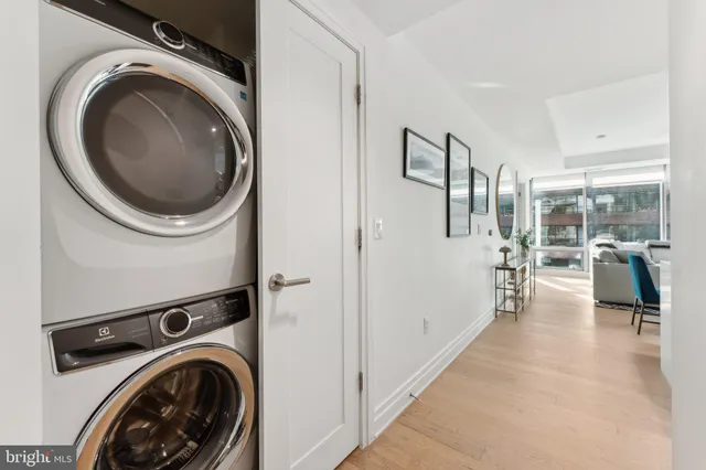 a view of a hallway with washer and dryer