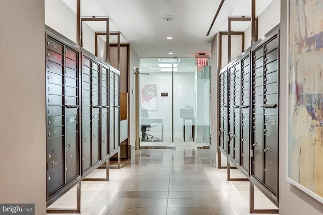 a view of an entryway with wooden floor and door