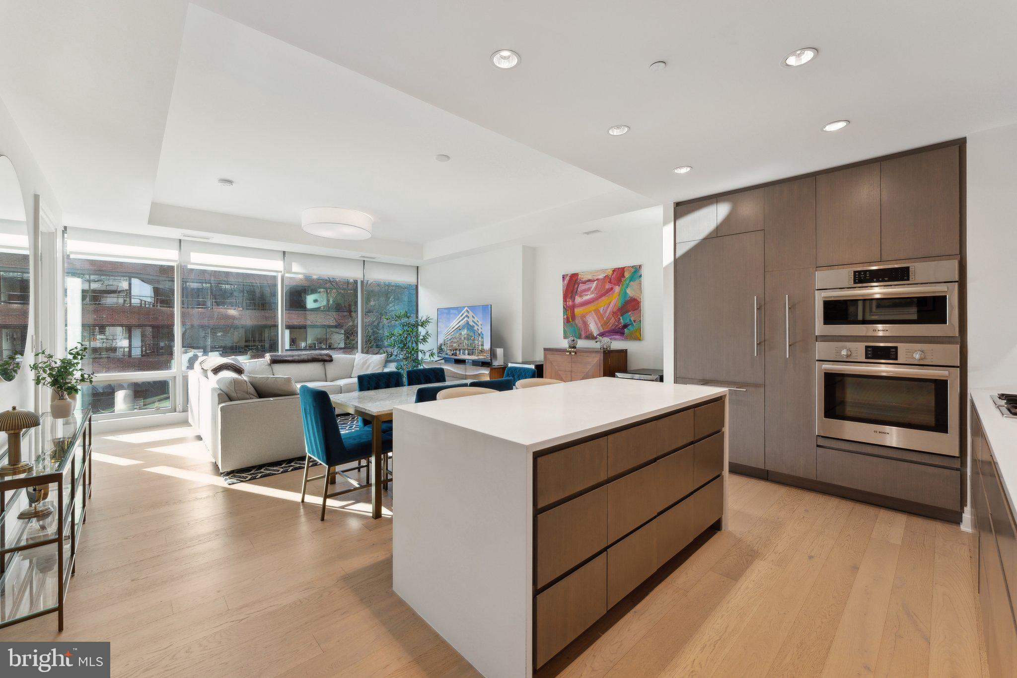 2501 M Street Northwest, Unit 207 Washington, DC 20037 - Photo 9 of 30 a kitchen that has a lot of cabinets in it and wooden flooring