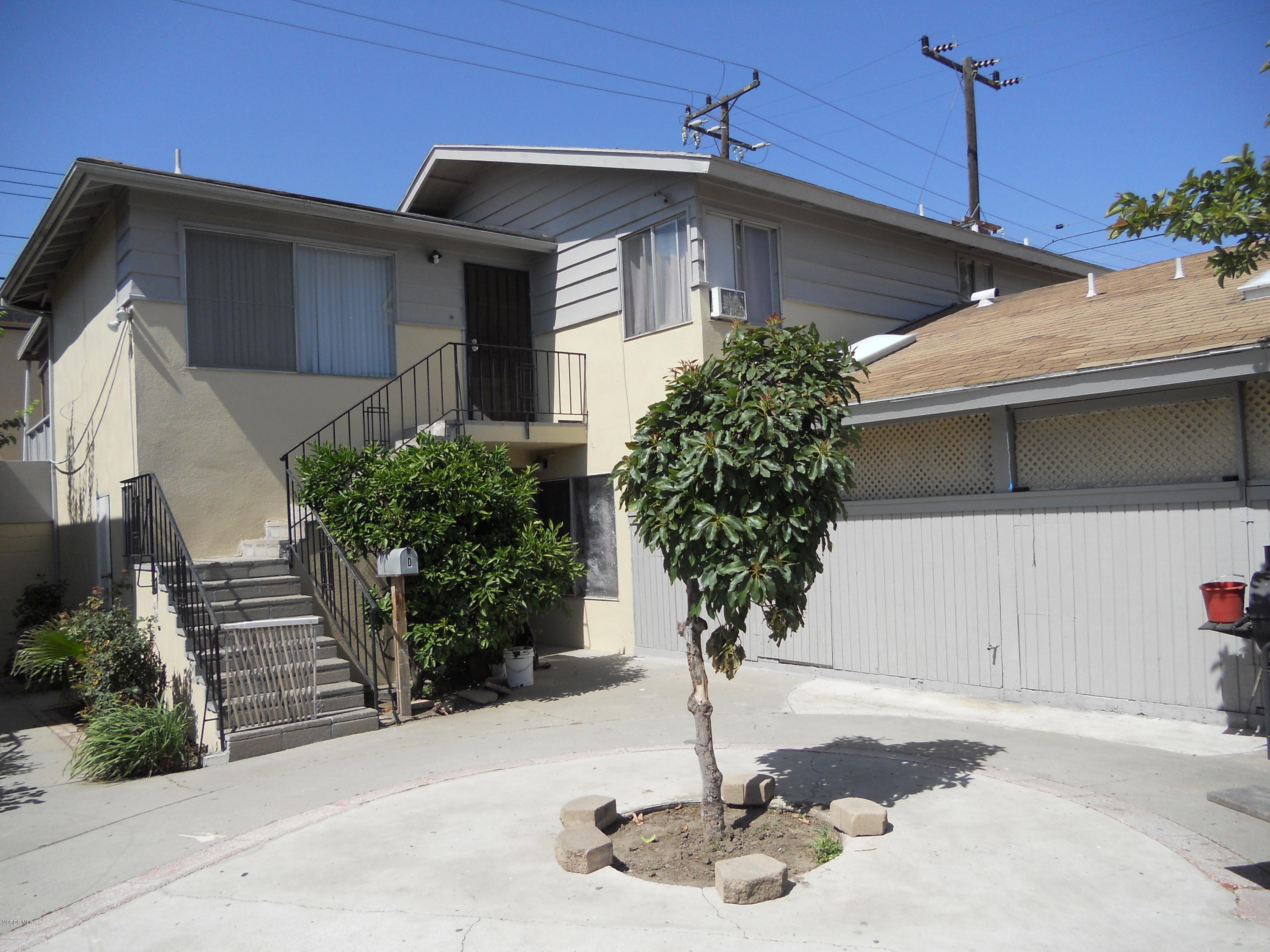 1325 Devonshire Drive Oxnard, CA 93030 - Photo 2 of 6 a front view of a house with a yard
