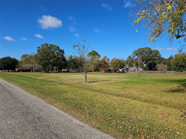 a view of a golf course with a lake