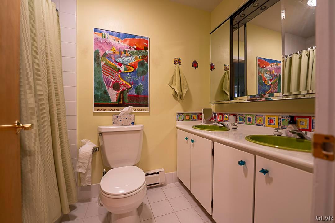 403 Georgetown Road Nazareth, PA 18064 - Photo 20 of 50 a bathroom with a toilet sink and mirror