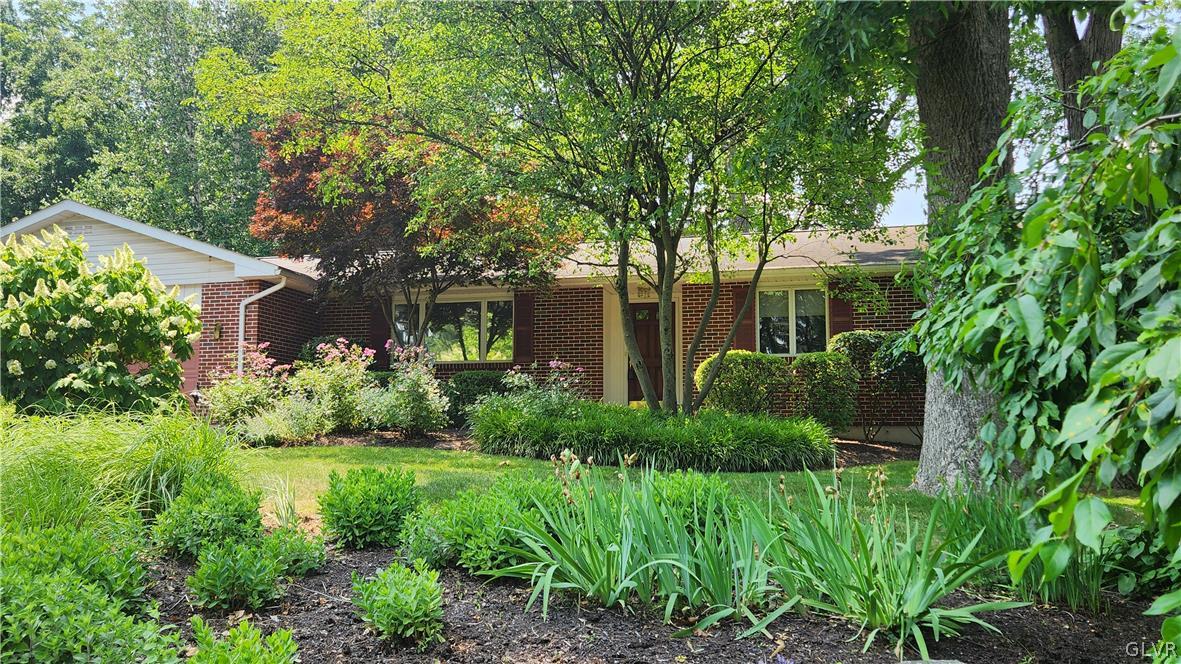 403 Georgetown Road Nazareth, PA 18064 - Photo 2 of 50 a view of a garden with plants and large trees