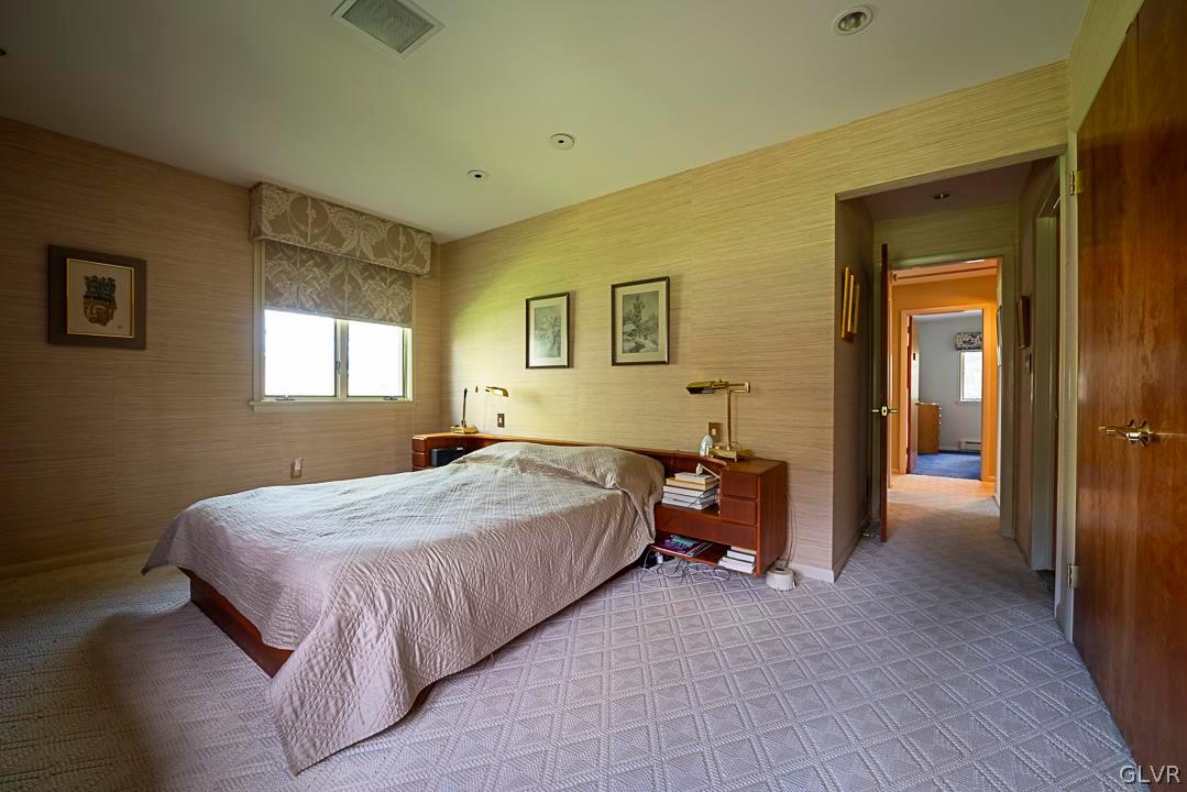 403 Georgetown Road Nazareth, PA 18064 - Photo 26 of 50 a bedroom with a bed and a chandelier