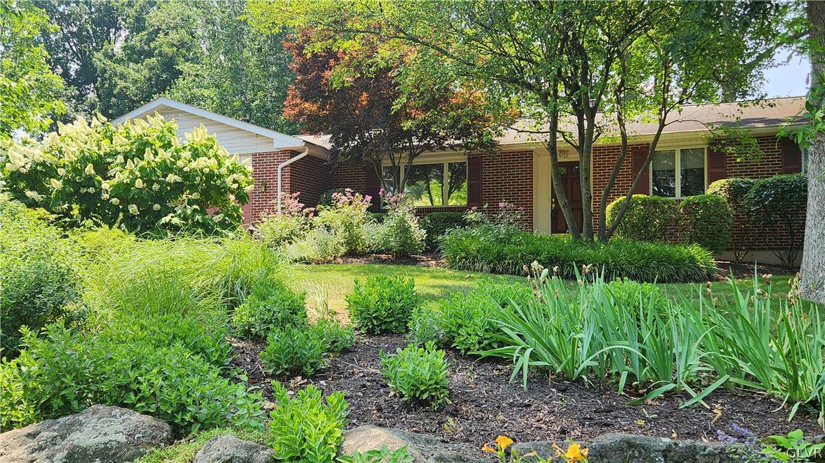 403 Georgetown Road Nazareth, PA 18064 - Photo 3 of 50 a view of a house with a yard and potted plants