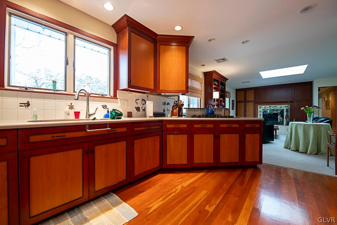 403 Georgetown Road Nazareth, PA 18064 - Photo 35 of 50 a kitchen with kitchen island granite countertop wooden floors and a sink