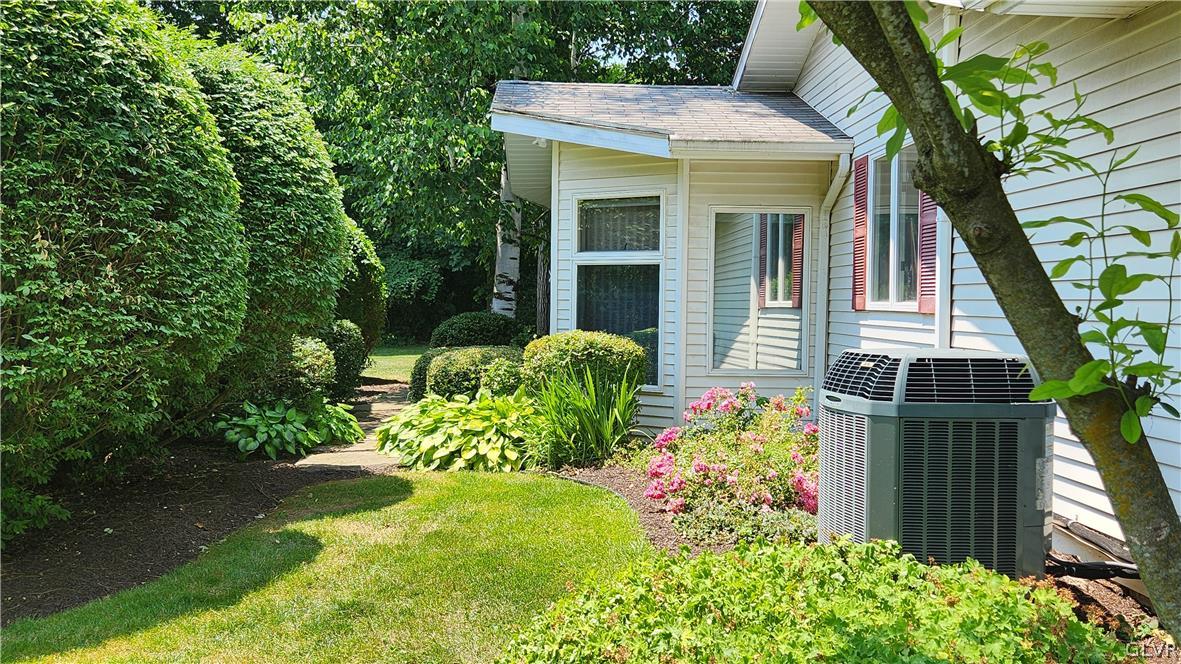 403 Georgetown Road Nazareth, PA 18064 - Photo 6 of 50 a view of a house with potted plants and a fountain