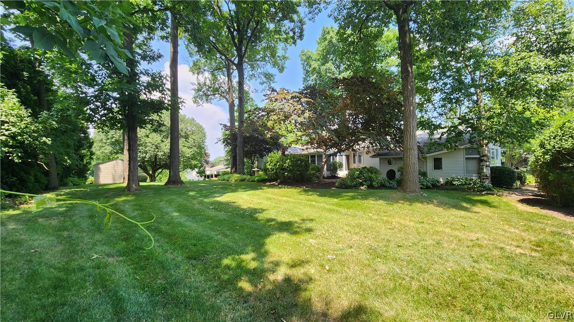 403 Georgetown Road Nazareth, PA 18064 - Photo 10 of 50 a backyard of a house with plants and large tree