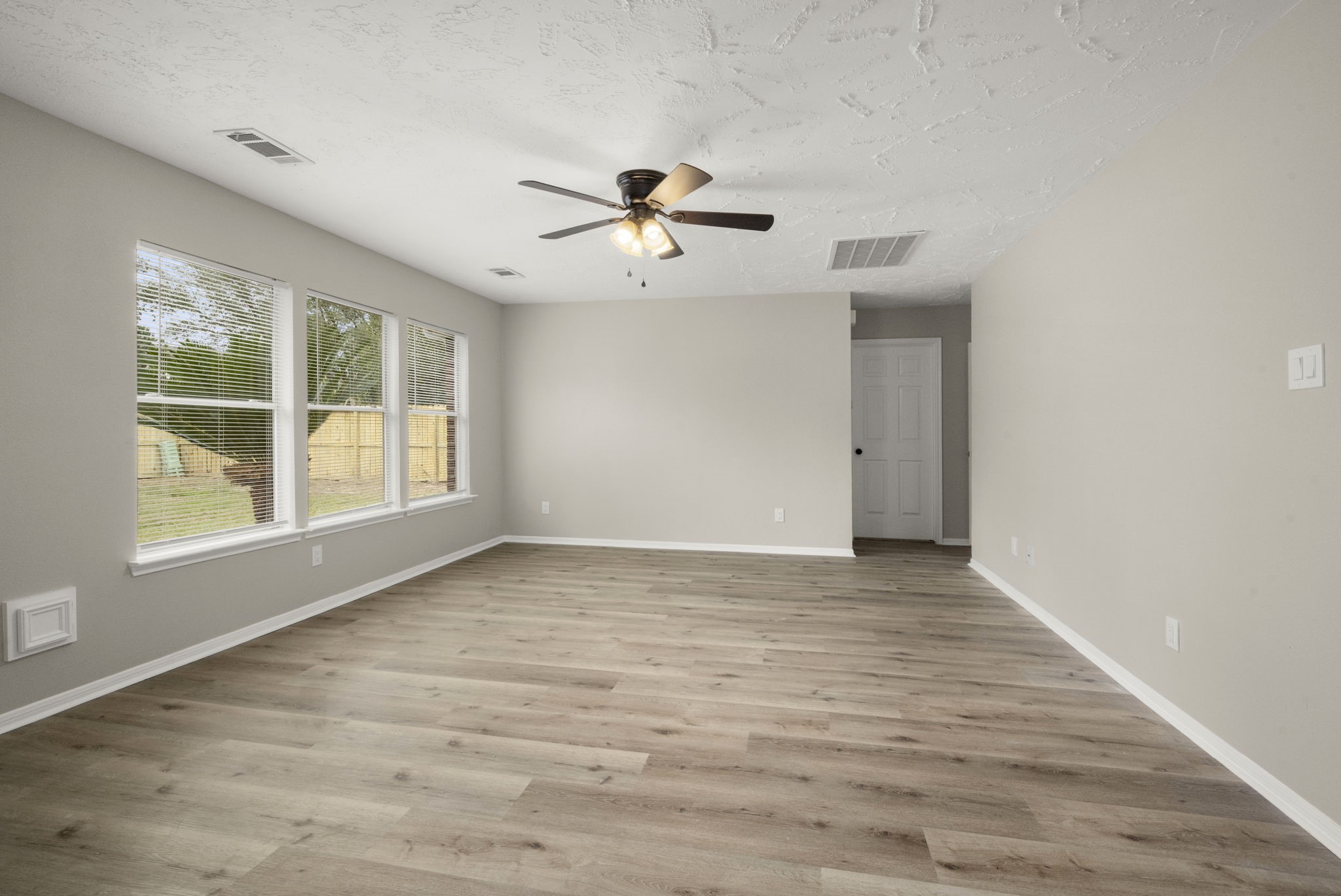 6615 Broken Stone Houston, TX 77084 - Photo 14 of 29 wooden floor in an empty room with a window