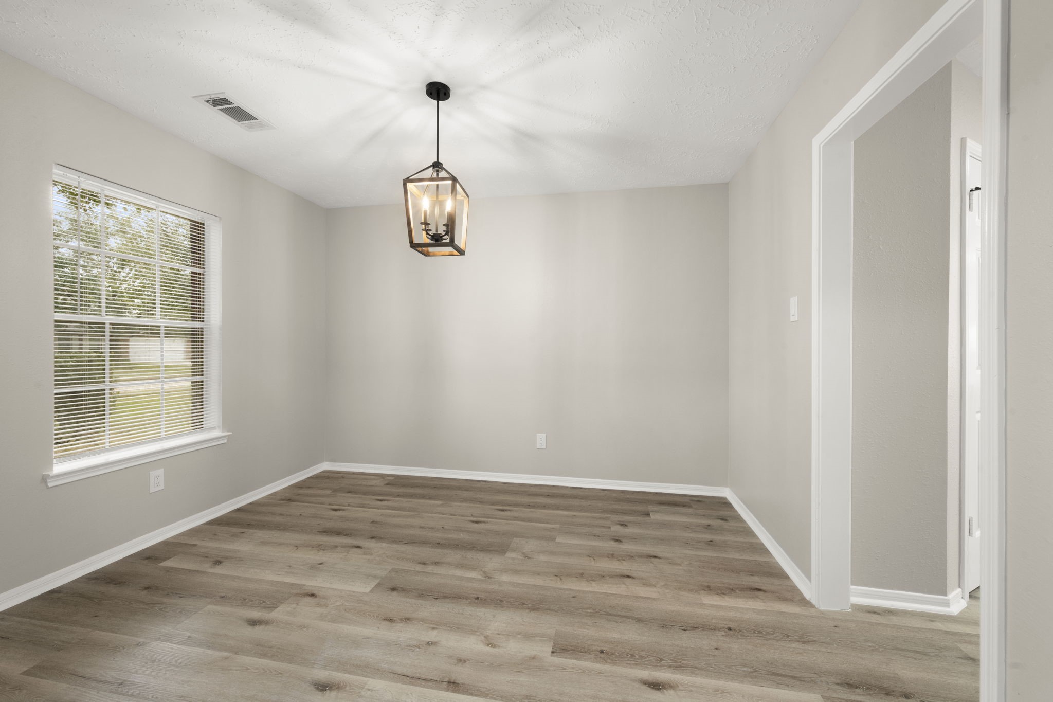 6615 Broken Stone Houston, TX 77084 - Photo 16 of 29 a view of empty room with wooden floor and window