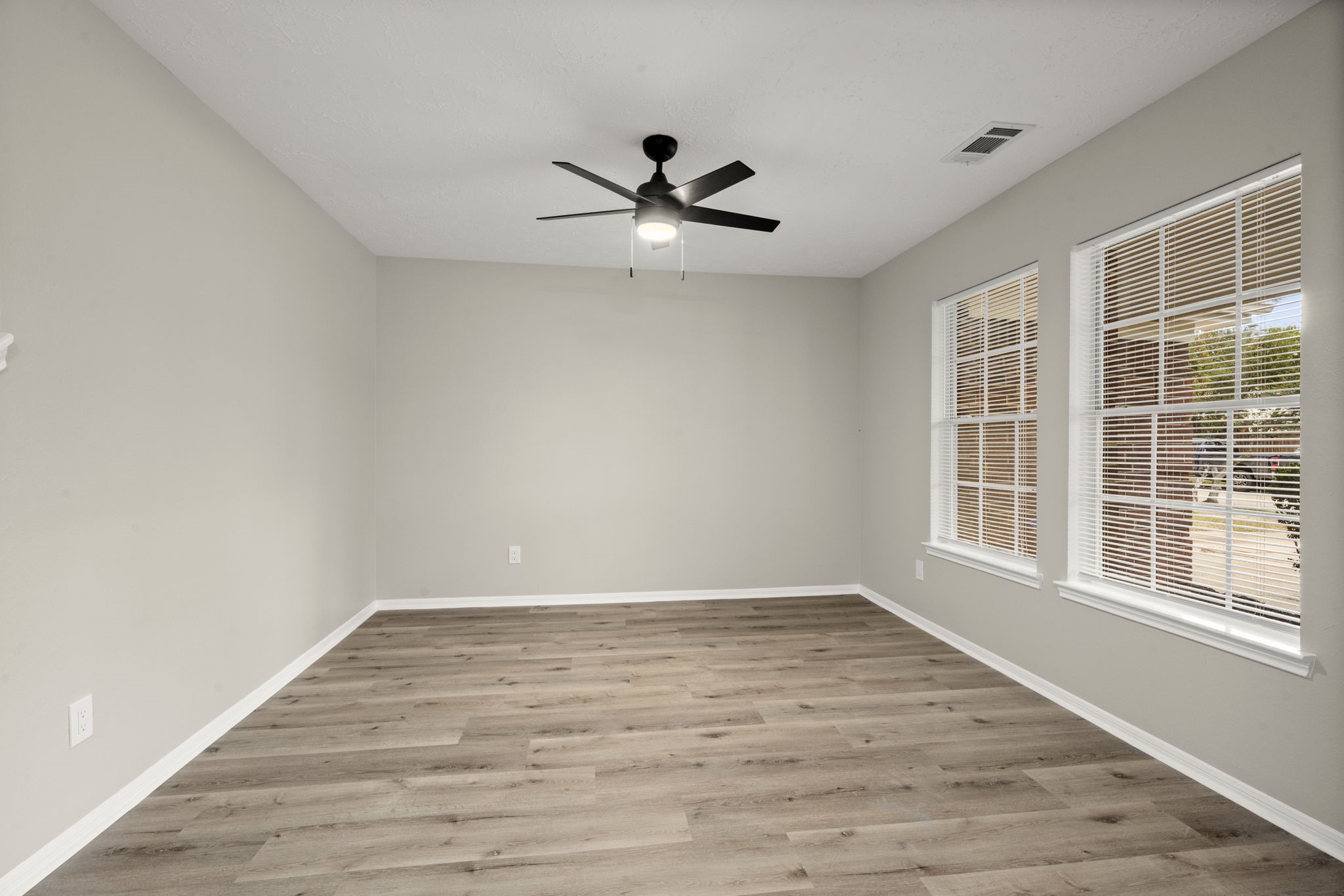 6615 Broken Stone Houston, TX 77084 - Photo 17 of 29 a view of an empty room with wooden floor and a window
