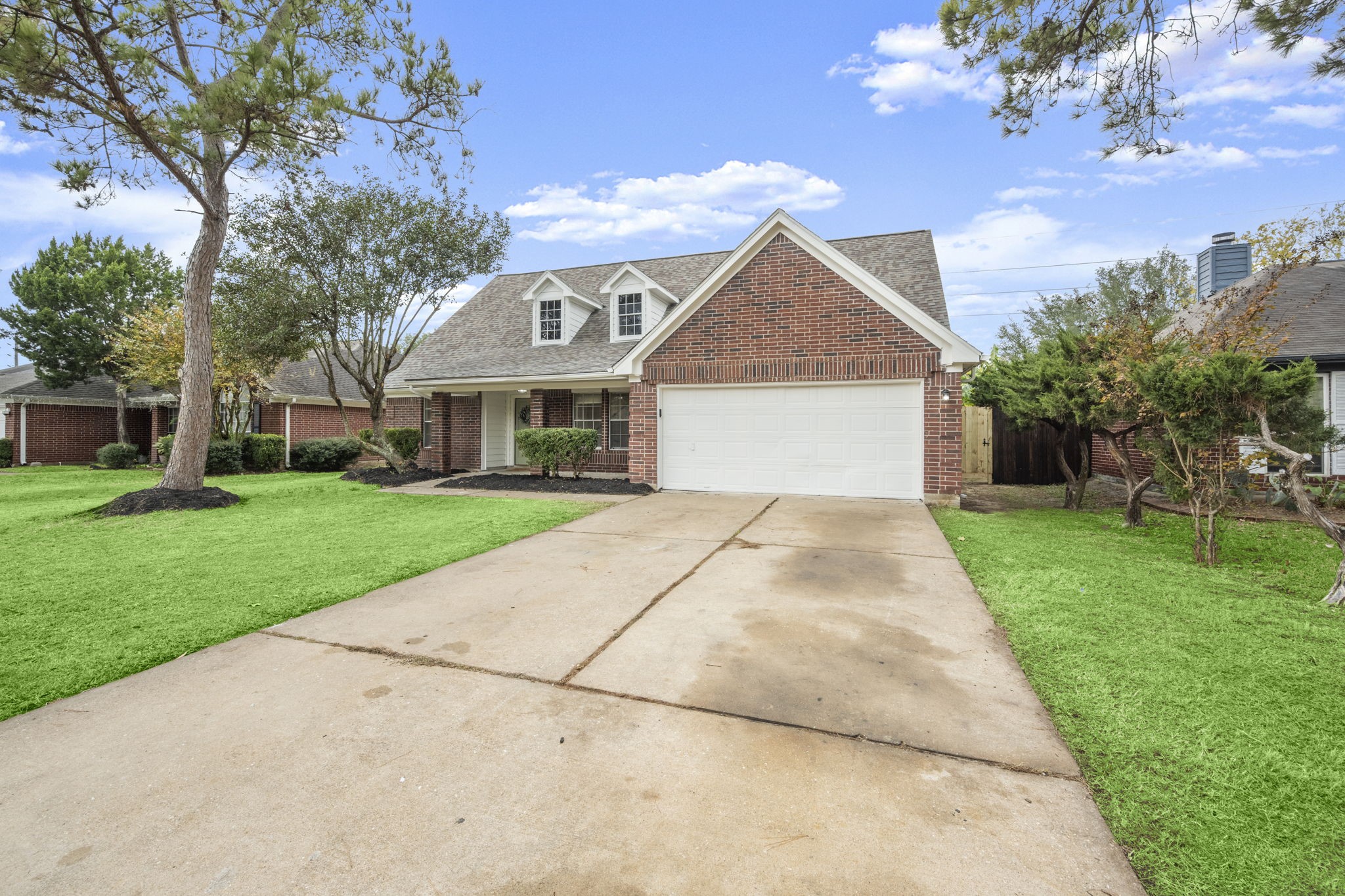 6615 Broken Stone Houston, TX 77084 - Photo 2 of 29 a front view of a house with a yard