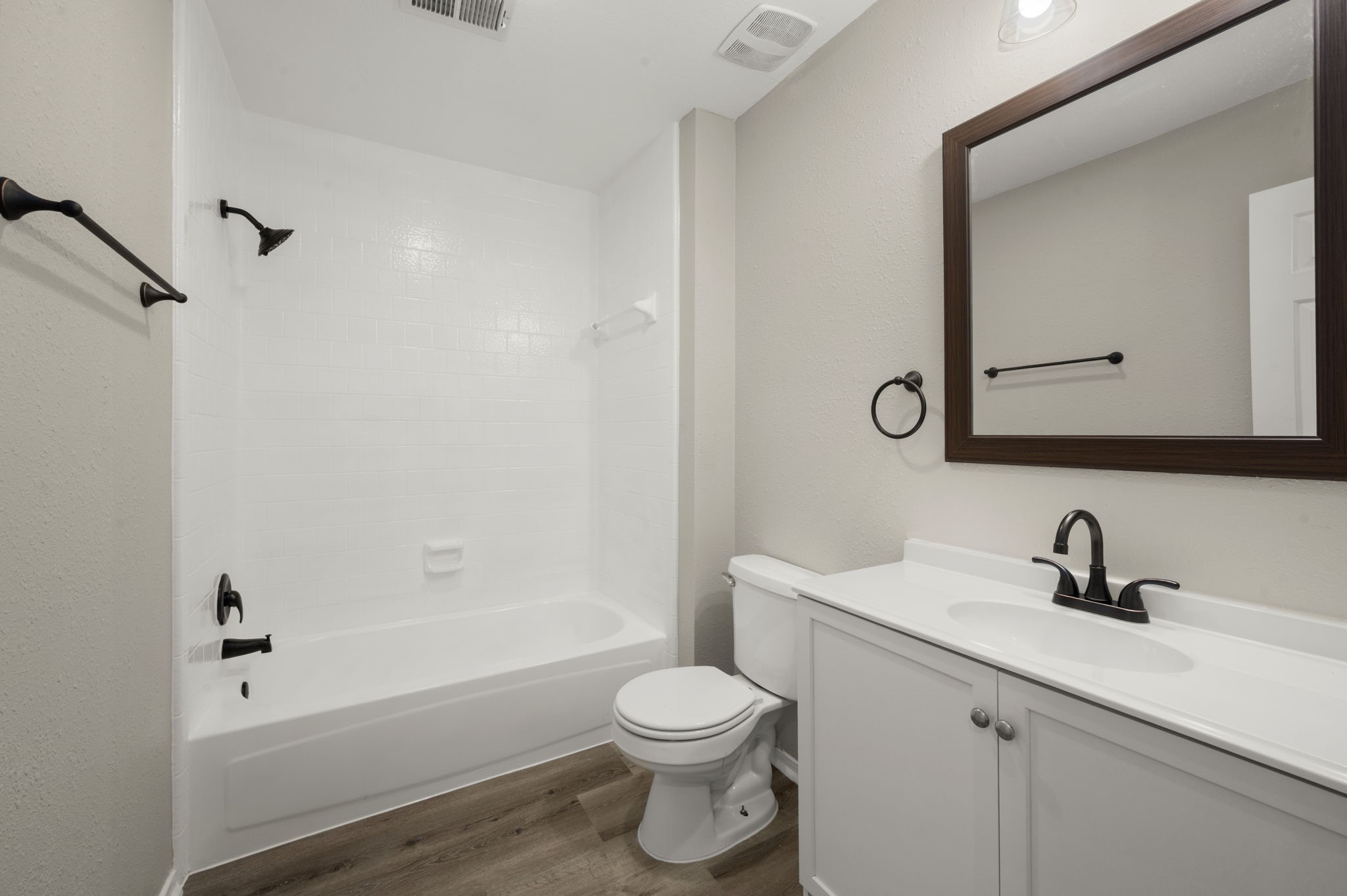 6615 Broken Stone Houston, TX 77084 - Photo 22 of 29 a bathroom with a sink a toilet and a mirror