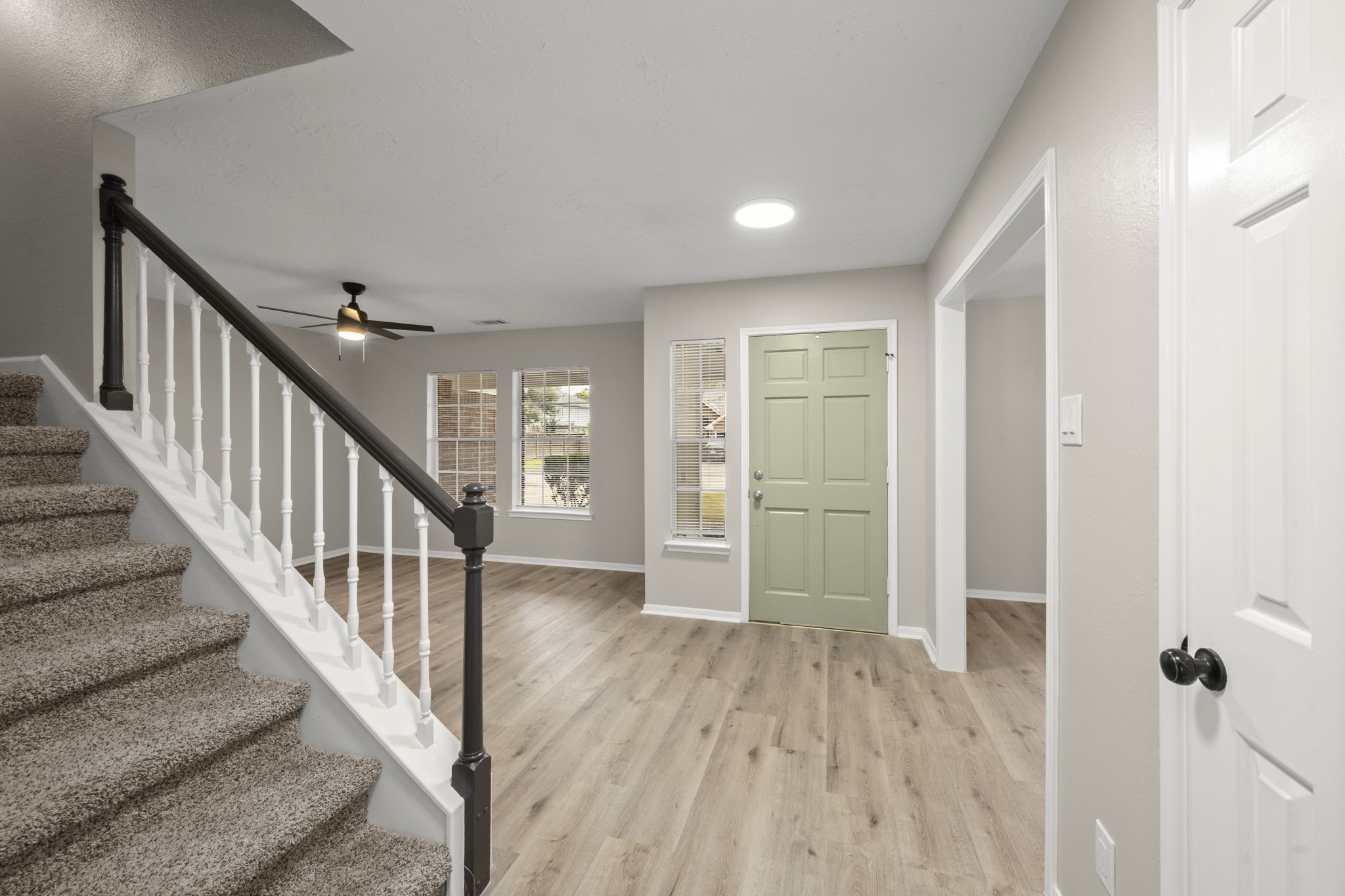6615 Broken Stone Houston, TX 77084 - Photo 5 of 29 a view of a hallway with wooden floor and entryway