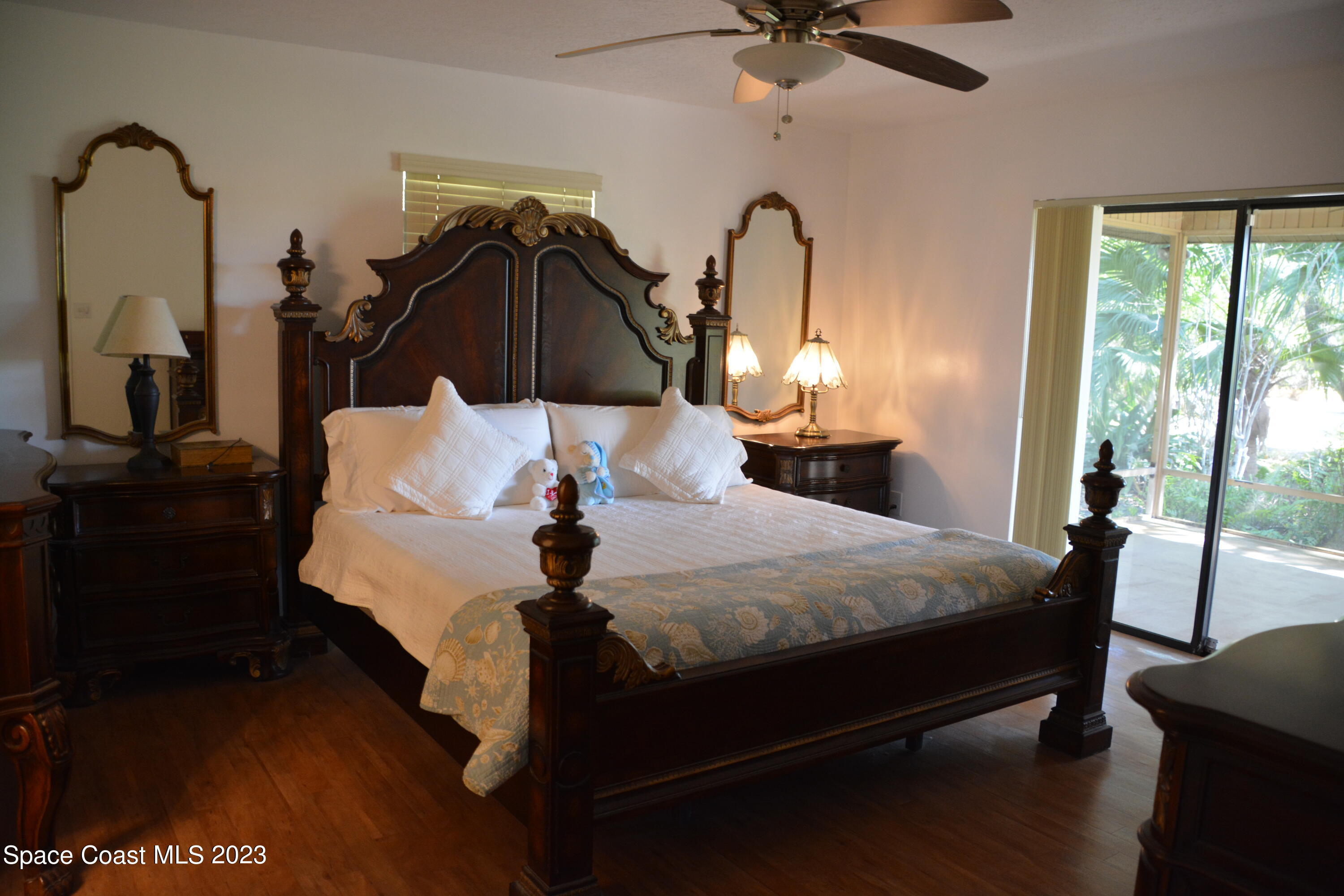 1045 Pine Island Road Merritt Island, FL 32953 - Photo 14 of 42 a bedroom with bed and window