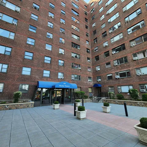 a view of a building with sitting area
