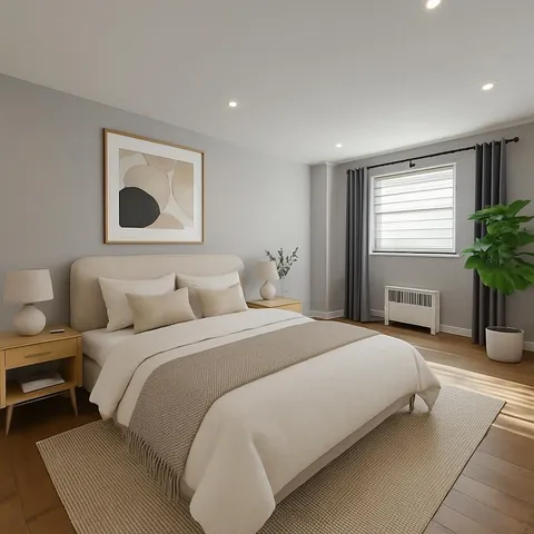 a bedroom with bed and a potted plant