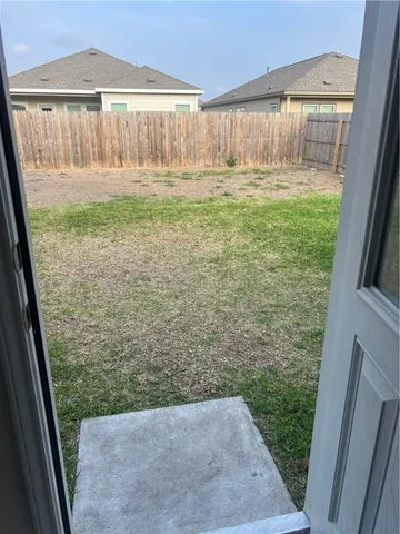 a view of a back yard from a balcony