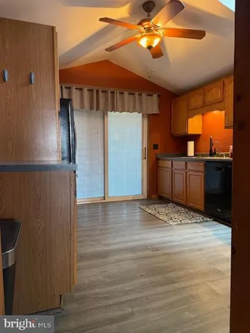 a view of a livingroom with furniture and wooden floor