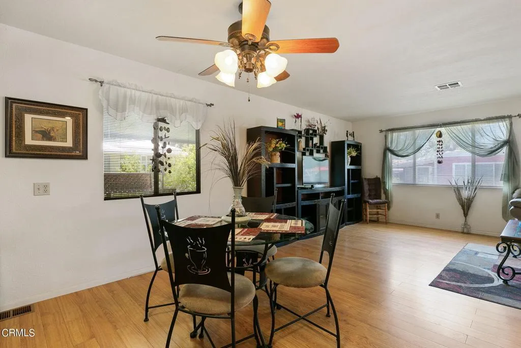 1273 South Rice Road, Unit 100 Ojai, CA 93023 - Photo 8 of 31 a view of a dining room with furniture and chandelier