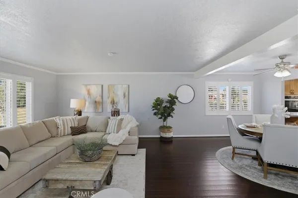 a living room with fireplace furniture and a fireplace