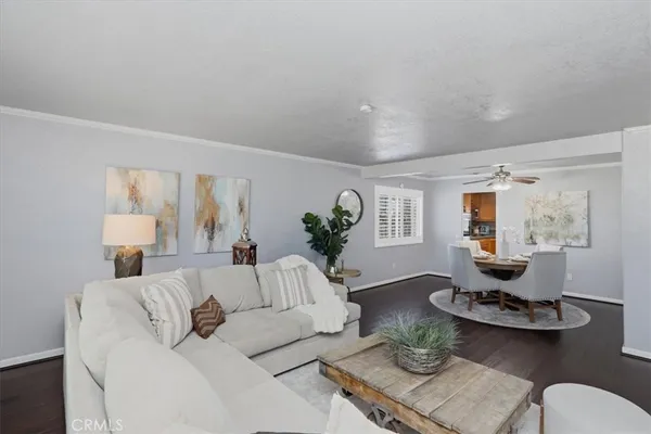 a living room with fireplace furniture and a wooden floor
