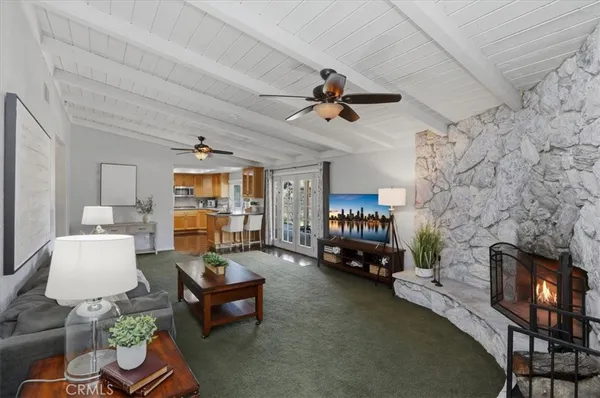 a kitchen with granite countertop stainless steel appliances a stove sink and microwave
