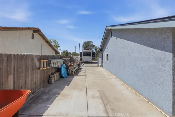 a view of a house with a swimming pool and a yard