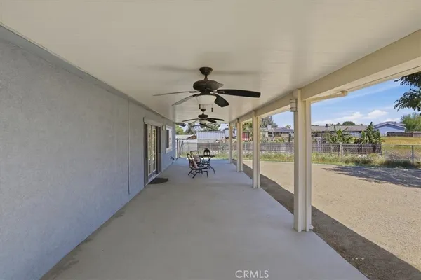 an aerial view of a house with outdoor space