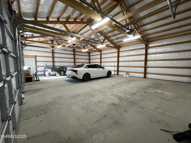 a view of parking garage with cars