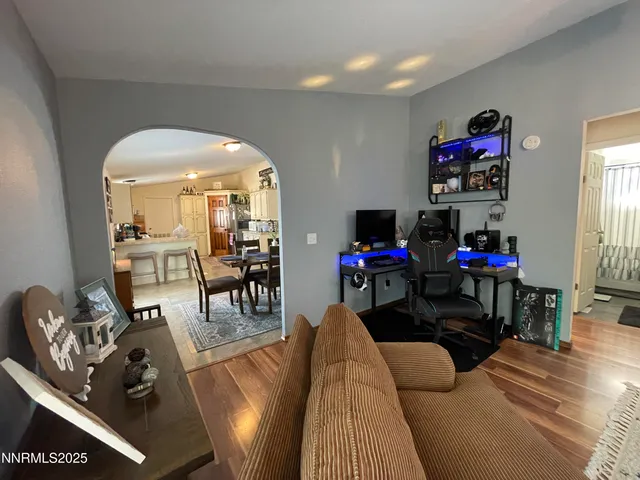 a living room with furniture and a flat screen tv