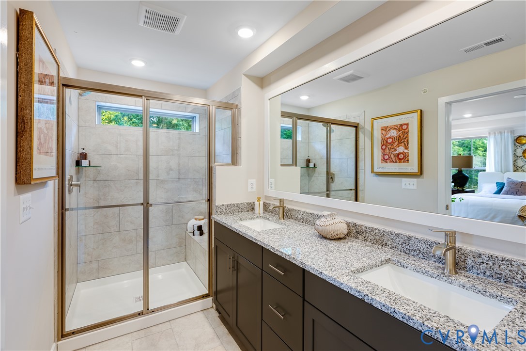 6115 Primrose Path Road Richmond, VA 23225 - Photo 15 of 23 a bathroom with a granite countertop sink mirror and double