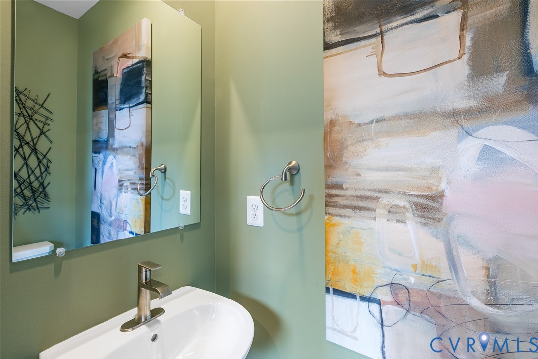 6115 Primrose Path Road Richmond, VA 23225 - Photo 17 of 23 a bathroom with a sink and mirror