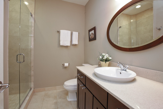 1255 West Addison Street, Unit 3 Chicago, IL 60613 - Photo 11 of 13 a bathroom with a sink toilet and mirror