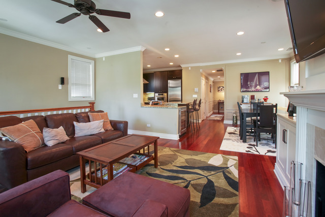 1255 West Addison Street, Unit 3 Chicago, IL 60613 - Photo 3 of 13 a living room with furniture and kitchen view
