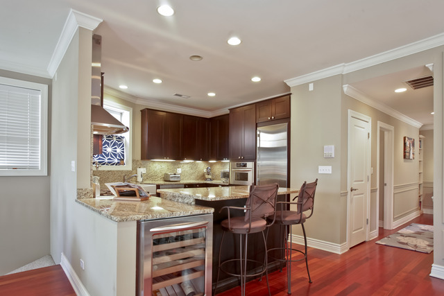 1255 West Addison Street, Unit 3 Chicago, IL 60613 - Photo 5 of 13 a kitchen with a table and chairs