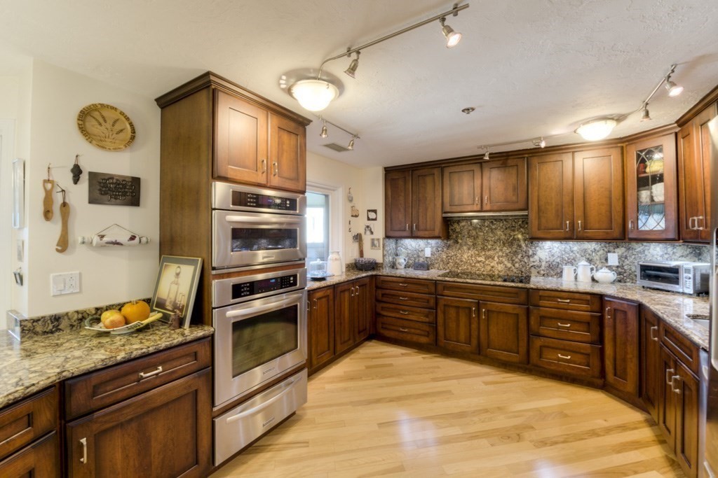 44 Elm Street, Unit 501 Worcester, MA 01609 - Photo 14 of 41 a kitchen with stainless steel appliances granite countertop a stove and a sink