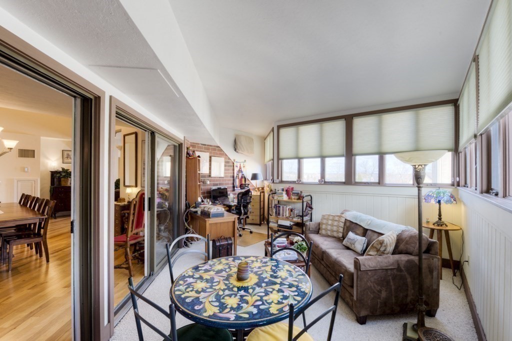 44 Elm Street, Unit 501 Worcester, MA 01609 - Photo 17 of 41 a living room with furniture a rug and a large window