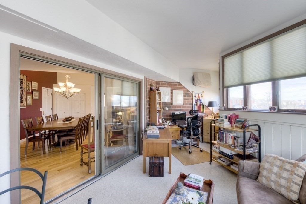 44 Elm Street, Unit 501 Worcester, MA 01609 - Photo 18 of 41 a living room with furniture and a large window