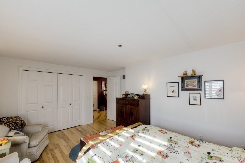 44 Elm Street, Unit 501 Worcester, MA 01609 - Photo 22 of 41 a bedroom with a bed and cabinets